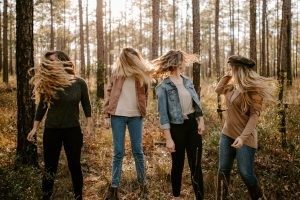 Four girls in the woods.