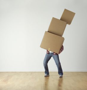 A man carrying boxes.