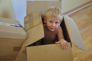 A boy in a moving box.