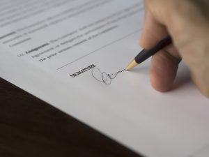 A signature on the contract.