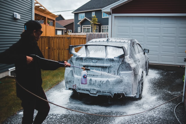 A man washing a car