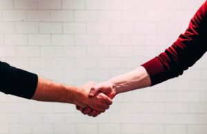 A handshake with a new business partner once you relocate your NYC company to Japan