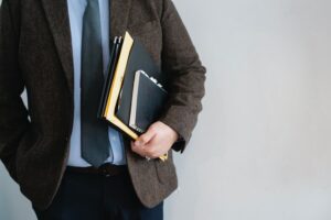 a person holding note books 