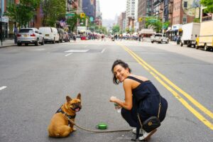 A woman with her dog in NYC.