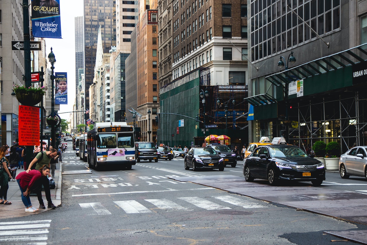 A bus on the streets of New York City, which is one of the most important budgeting tips for adjusting to NYC expenses. 