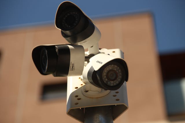 Three security cameras on the pole